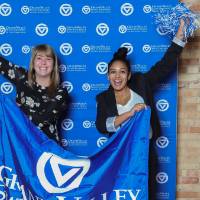 Lakers pose with GVSU banner